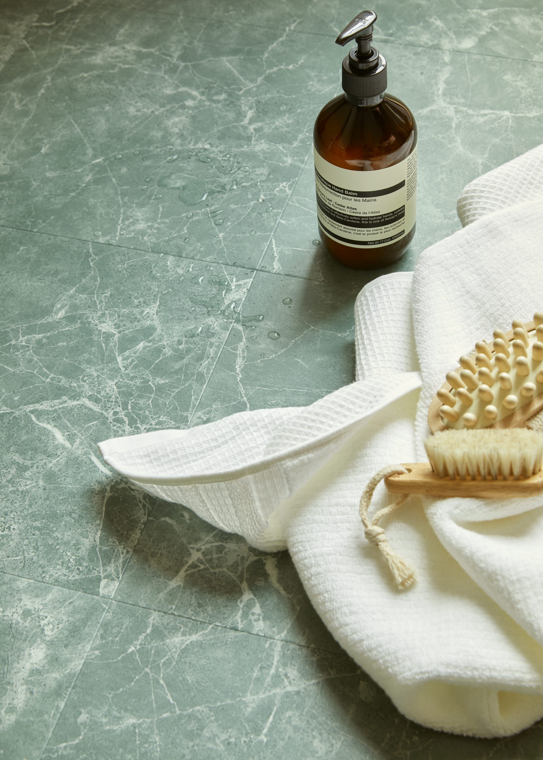 Amtico Signature Verde Classic Marble tile floor in bathroom setting