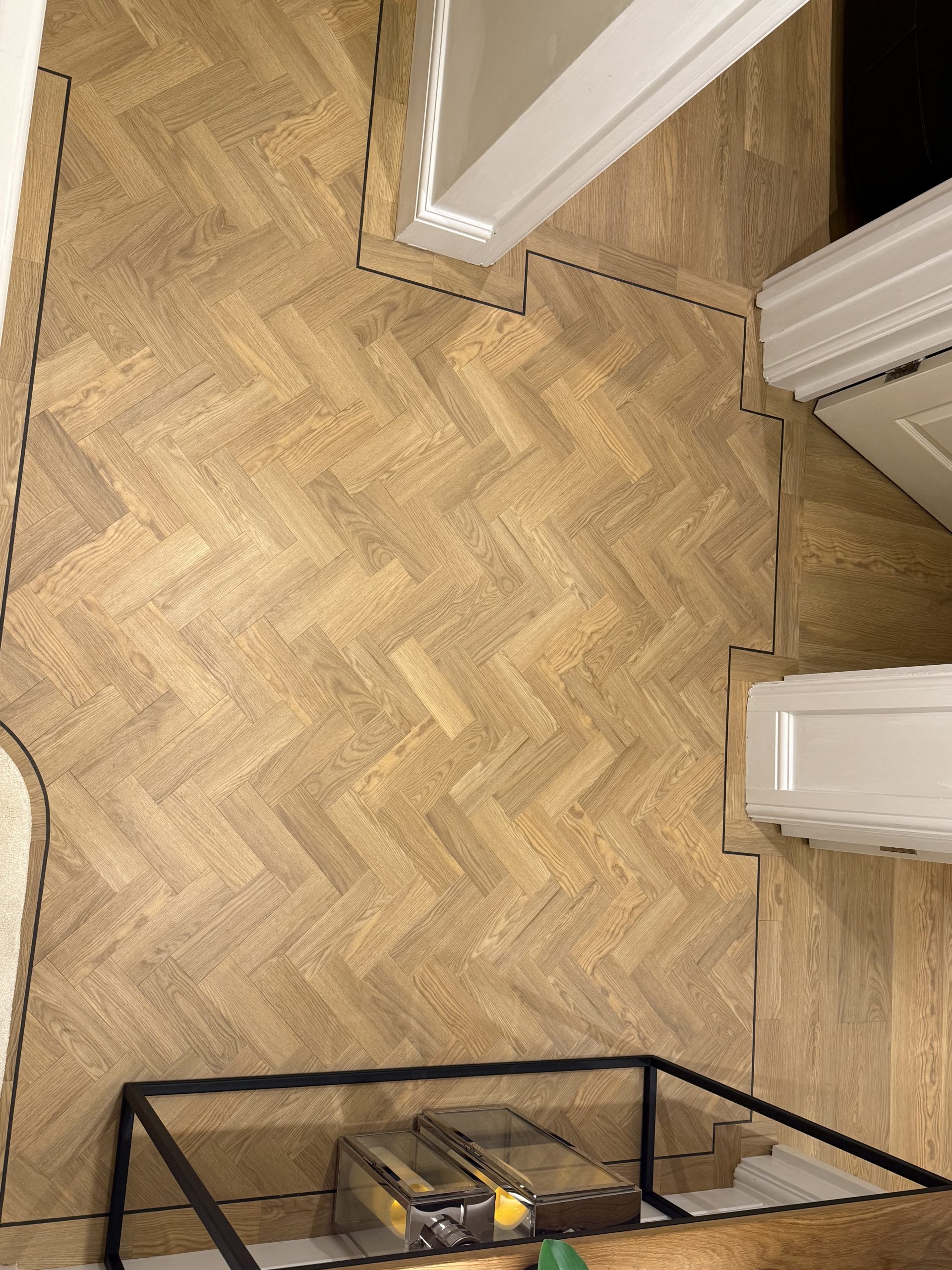 Amtico Spacia Pale Ash parquet with dark walnut design strip detail